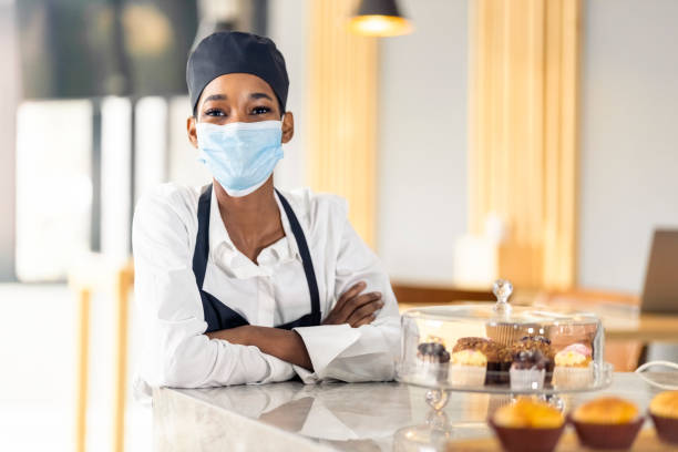 istock Waitress working at a cafe during coronavirus pandemic 1319654659