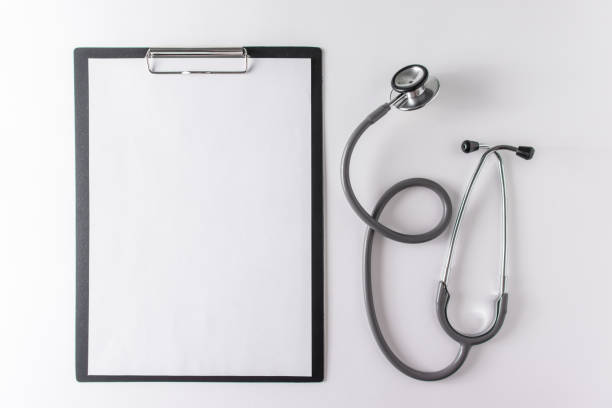 istock Stethoscope and blank clipboard with a sheet of paper. 1319654720