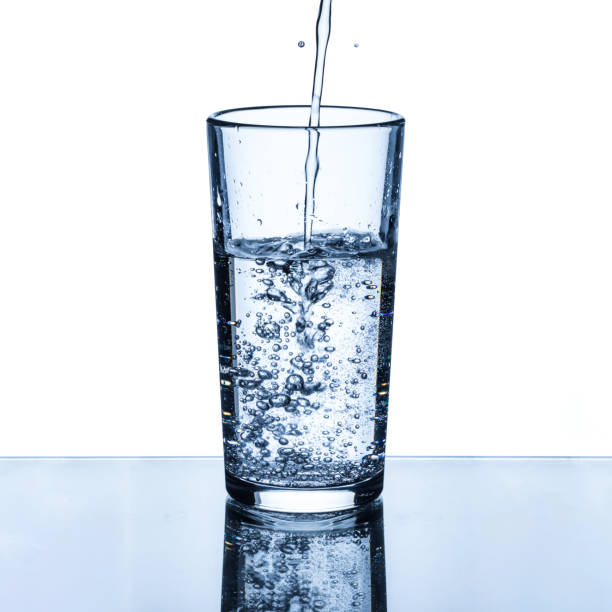 istock A stream of clean drinking water is poured into a glass cup 1319655322