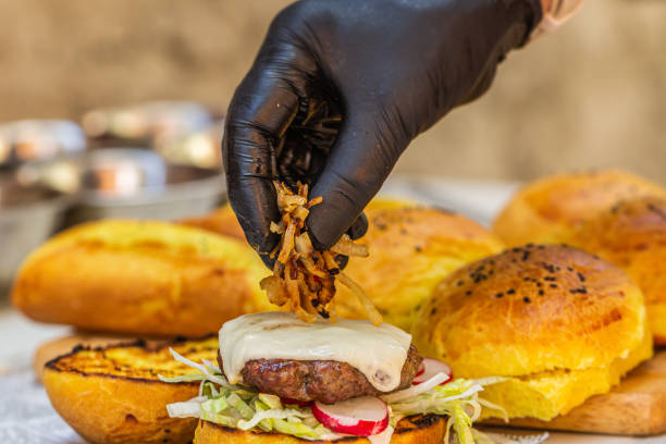istock Chef prepares fresh delicious burger with ingredients 1319655784