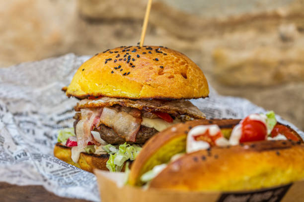 istock Big tasty beef burger full of fresh vegetable 1319656341