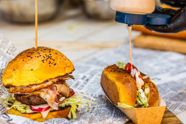 istock Chef prepares fresh delicious burger with ingredients 1319656361