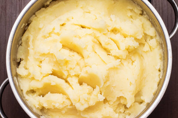 Mashed potatoes in a pan, top view Mashed potatoes in a pan, top view mashed potatoes stock pictures, royalty-free photos & images