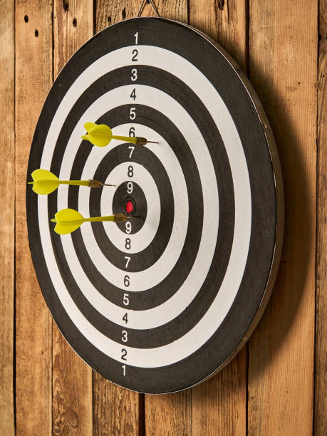 istock Darts game. Throwing darts at the target 1319658125