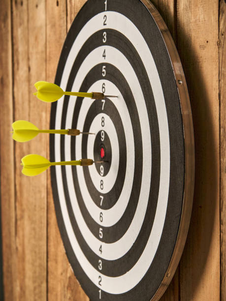 istock Darts game. Throwing darts at the target 1319658141