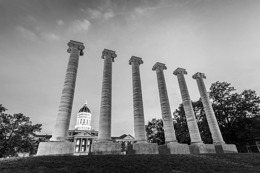 Architectural columns and Jesse Hall on the campus of University of Missouri. University of Missouri - Mizzou campus at sunset.