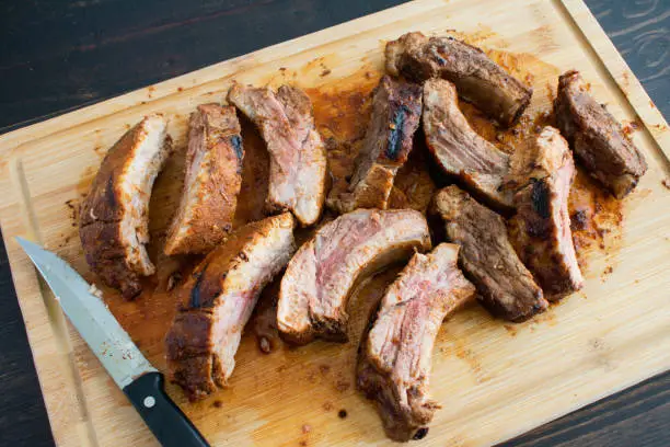 Pork  back ribs on a wooden carving board