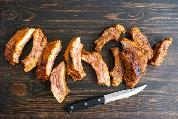 Pork  back ribs on a dark wood background