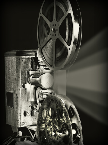 Antique movie projector in black and white.