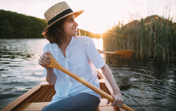 istock Smiling woman enjoying a canoe ride 1319671198