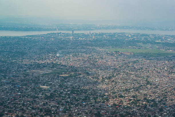 Aerial view of Kinshasa, capital of DR Congo Aerial view of Kinshasa, capital of the Democratic Republic of Congo. In the background Congo River is visible and on the other side of the river the city of Brazzaville, capital of the Republic of Congo is visible. kinshasa stock pictures, royalty-free photos & images