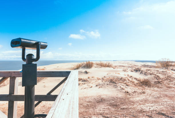 Wooden observation deck with fixed observation metal binoculars Curonian Spit. Wooden observation deck with fixed observation metal binoculars. Far view, clear day, tourist spot kaliningrad stock pictures, royalty-free photos & images