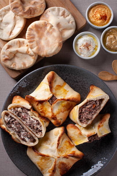 istock Meat sfiha. Typical Arabic dish that has been adapted for Brazilian cuisine. 1319683165