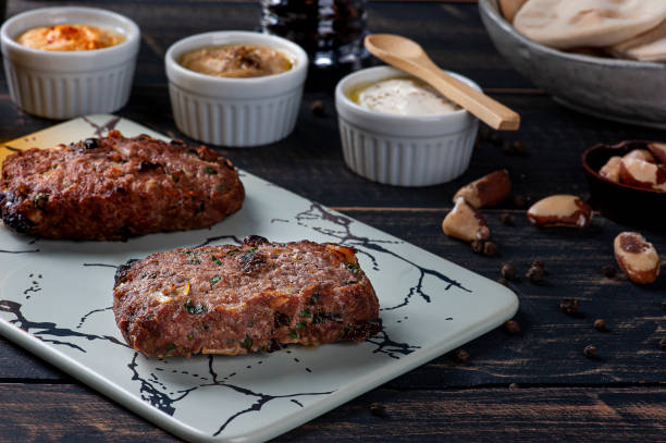 istock Turkish kafta, accompanied by curd, hummus and babaganoush. Top view 1319683293