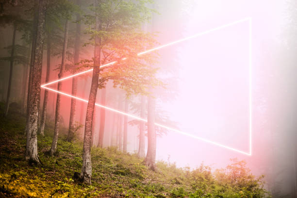 istock Mystical pink futuristic vertical triangle neon light between trees in forest 1319684180