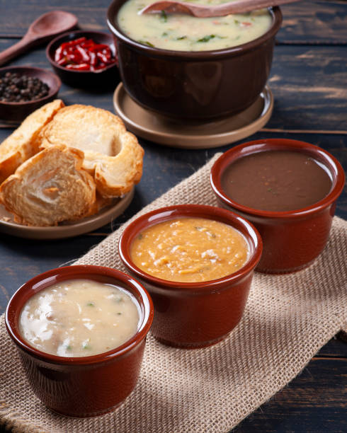 variety of broths, beans, cassava and green broth. winter food - caldo imagens e fotografias de stock