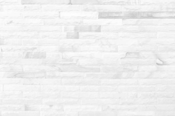 istock White grunge brick wall texture background for stone tile block painted in grey light color wallpaper modern interior and exterior and room backdrop design 1319688612