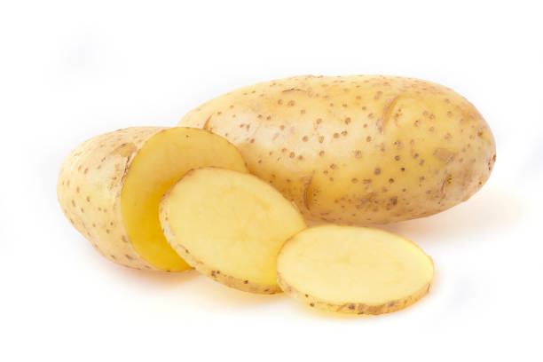 istock potato slide isolated on white background, macro 1319691303