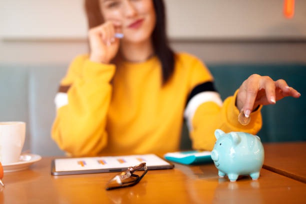 istock woman is saving money and calculation financial state 1319694572
