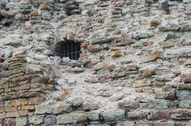 Iron barred window of an old fortress.