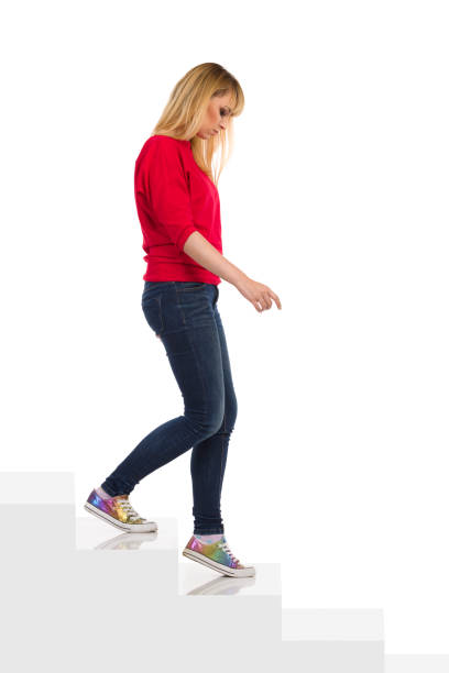 istock Sad Woman Is Walking Down The Stairs 1319694983