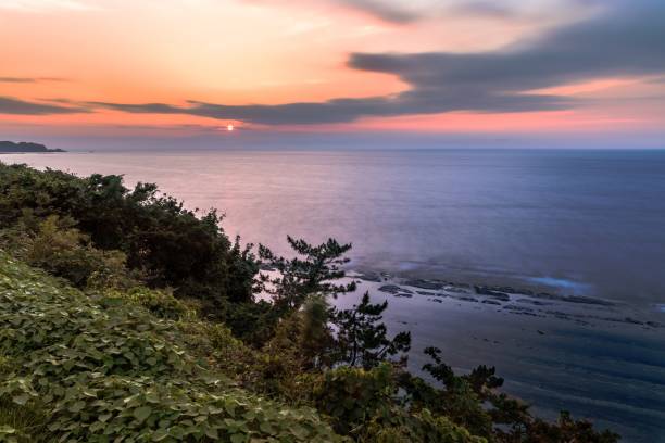istock Summer sunset scenery from Rokugozaki cape in Ishikawa prefecture, Japan 1319697942
