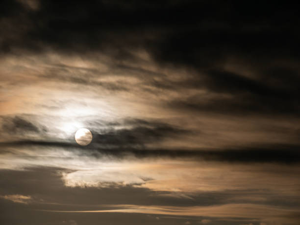 istock Rising Sun behind The Streaming Gray Clouds 1319698042