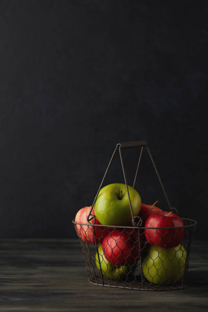 Still Life Background with Apples in Wire Basket