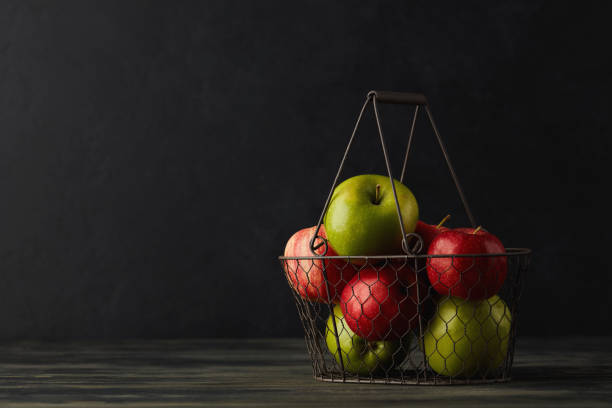 Still Life Background with Apples in Wire Basket Still Life Background with Apples in Wire Basket basket healthy eating vegetarian food studio shot stock pictures, royalty-free photos & images
