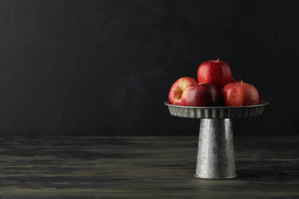 Still Life Background with Apples in Silver Stand