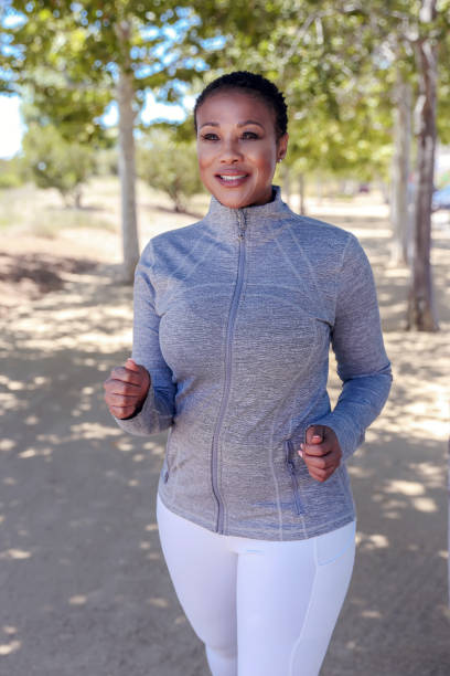 istock Attractive black woman exercising in nature 1319704432