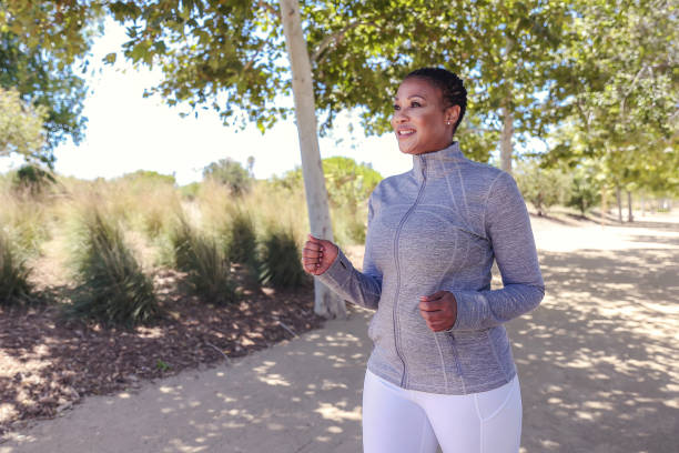 istock Attractive black woman exercising in nature 1319704518