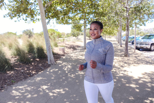 istock Attractive black woman exercising in nature 1319704543