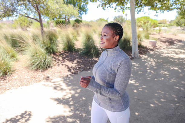 istock Attractive black woman exercising in nature 1319704562