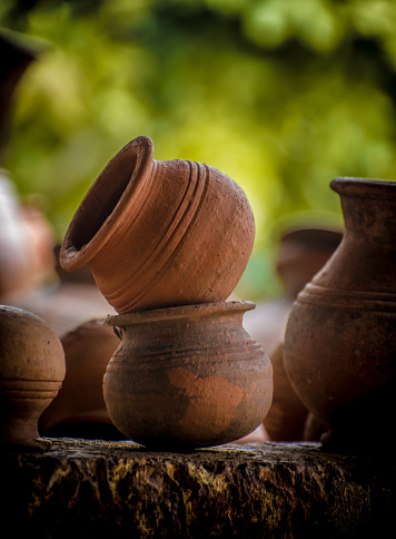 Close-up shot of clay pots on one another with beautiful Bokeh background.