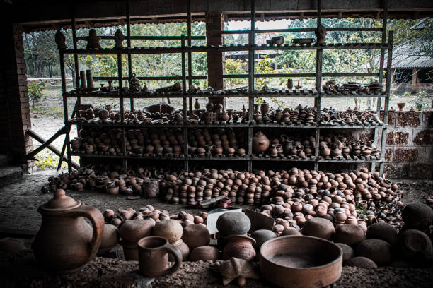 Collection of large quantity clay pots and jars in the workshop.