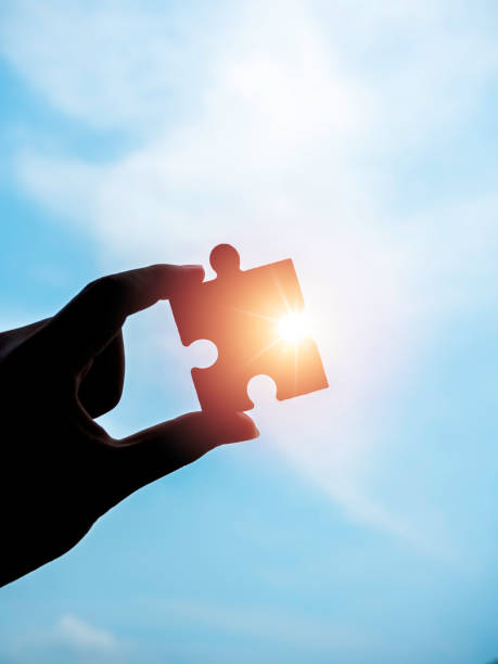 istock Jigsaw puzzle against blue sky background. 1319707271