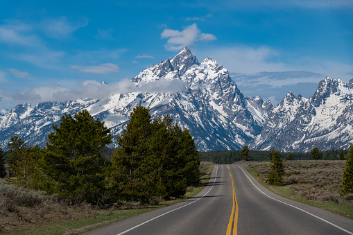 View of the Teton mountain range as seen approaching the Grand Teton peaks from the northeast. Near towns are Dubois, Moran and Jackson Hole, Wyoming in western USA