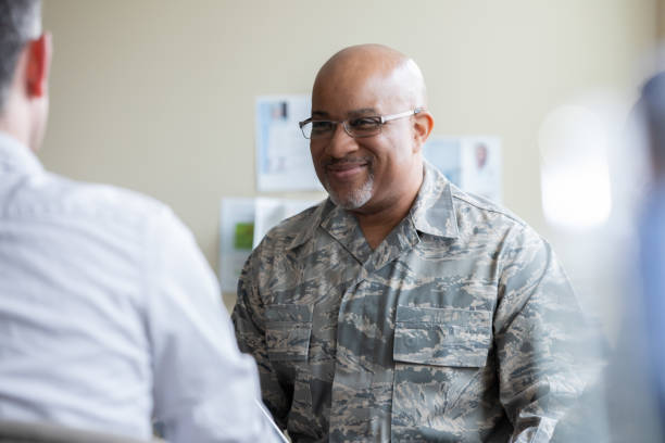istock Senior military man smiling during group therapy discussion 1319713335
