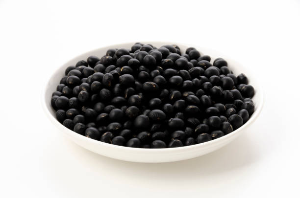 istock uncooked black beans on a plate on white background 1319713881