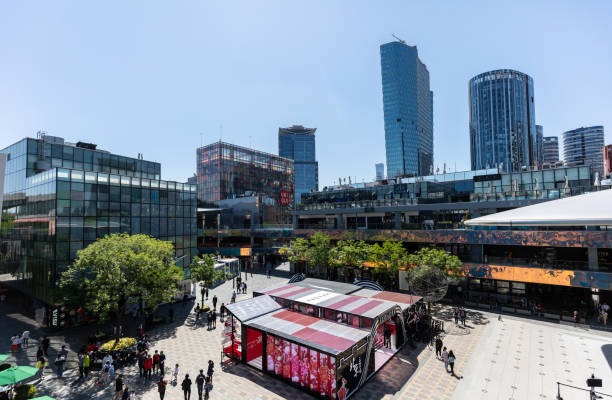 tourists spend the may day holiday shopping, leisure and entertainment in the taikoo li commercial district in sanlitun. - sanlitun imagens e fotografias de stock