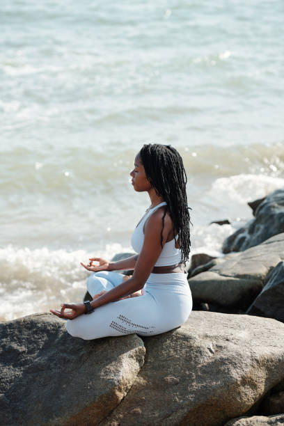 istock Woman in actvewear meditating 1319717519