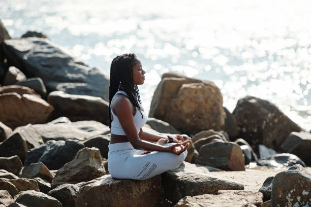 istock Relaxed sportswoman meditating 1319717522