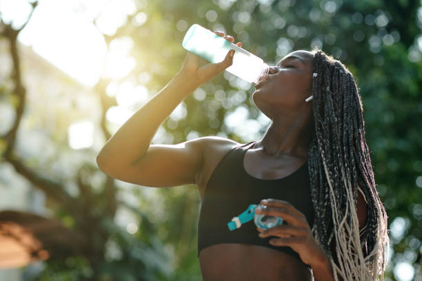 istock FIt woman drinking water 1319717929