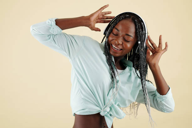 istock Pretty woman dancing and singing 1319718041