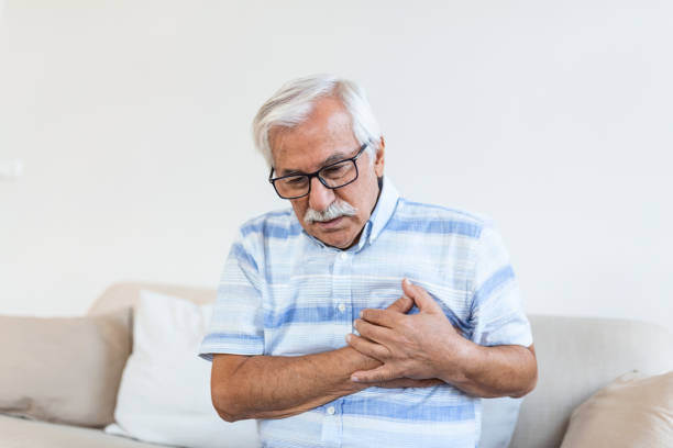 istock Senior man suffering chest pain, heart attack, problems with breathing, asthma. Elderly man having problems with angina pectoris 1319720026