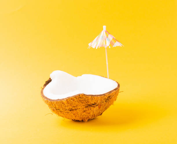 istock fresh coconut and sun umbrella 1319723622