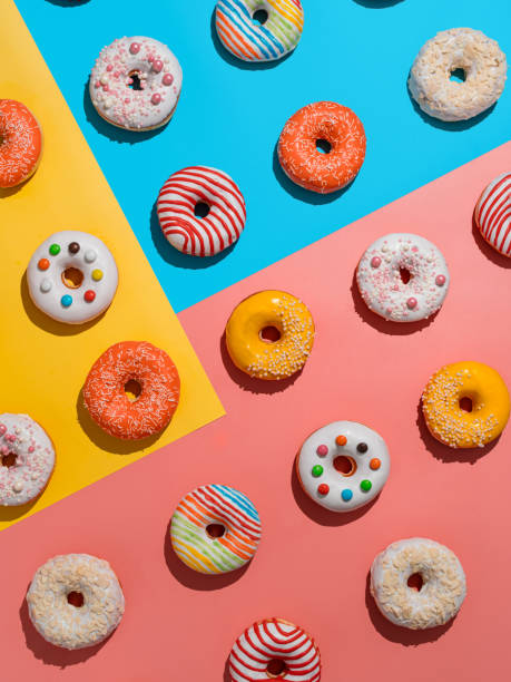 istock Glazed colorful donuts background, top view 1319724659