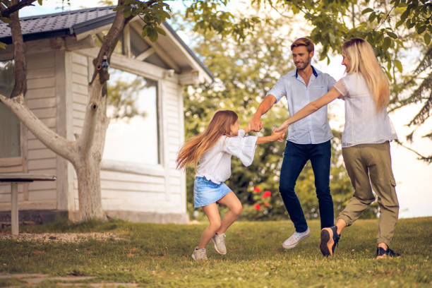 istock Happy family playing in backyard. 1319725611
