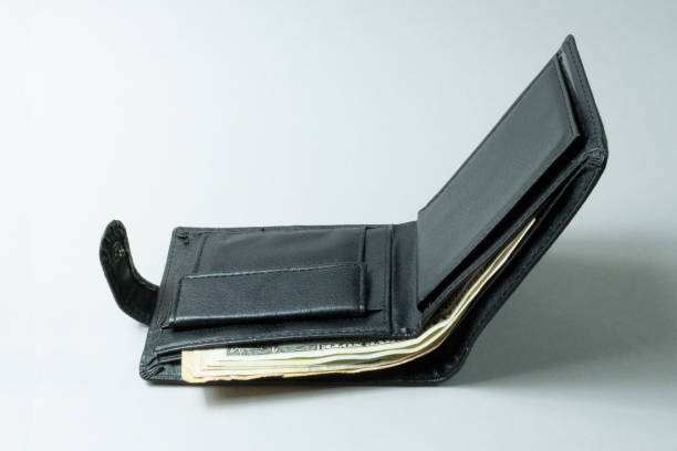 istock Wallet with money on the table. 1319726519